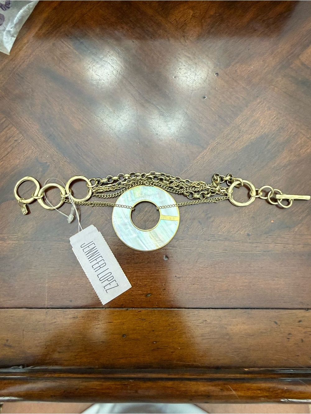 Jennifer Lopez Gold-Tone Bracelet with White Mother-of-Pearl Disc